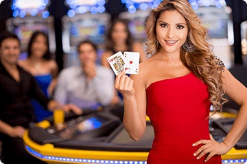Live dealer hosting blackjack game with cards and chips